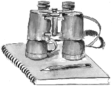 Fernglas auf Notizbuch